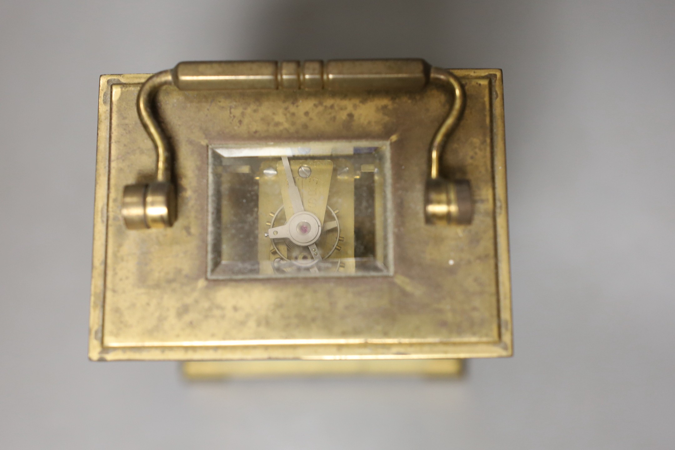 A Dent retailed brass carriage timepiece, 12 cms high.